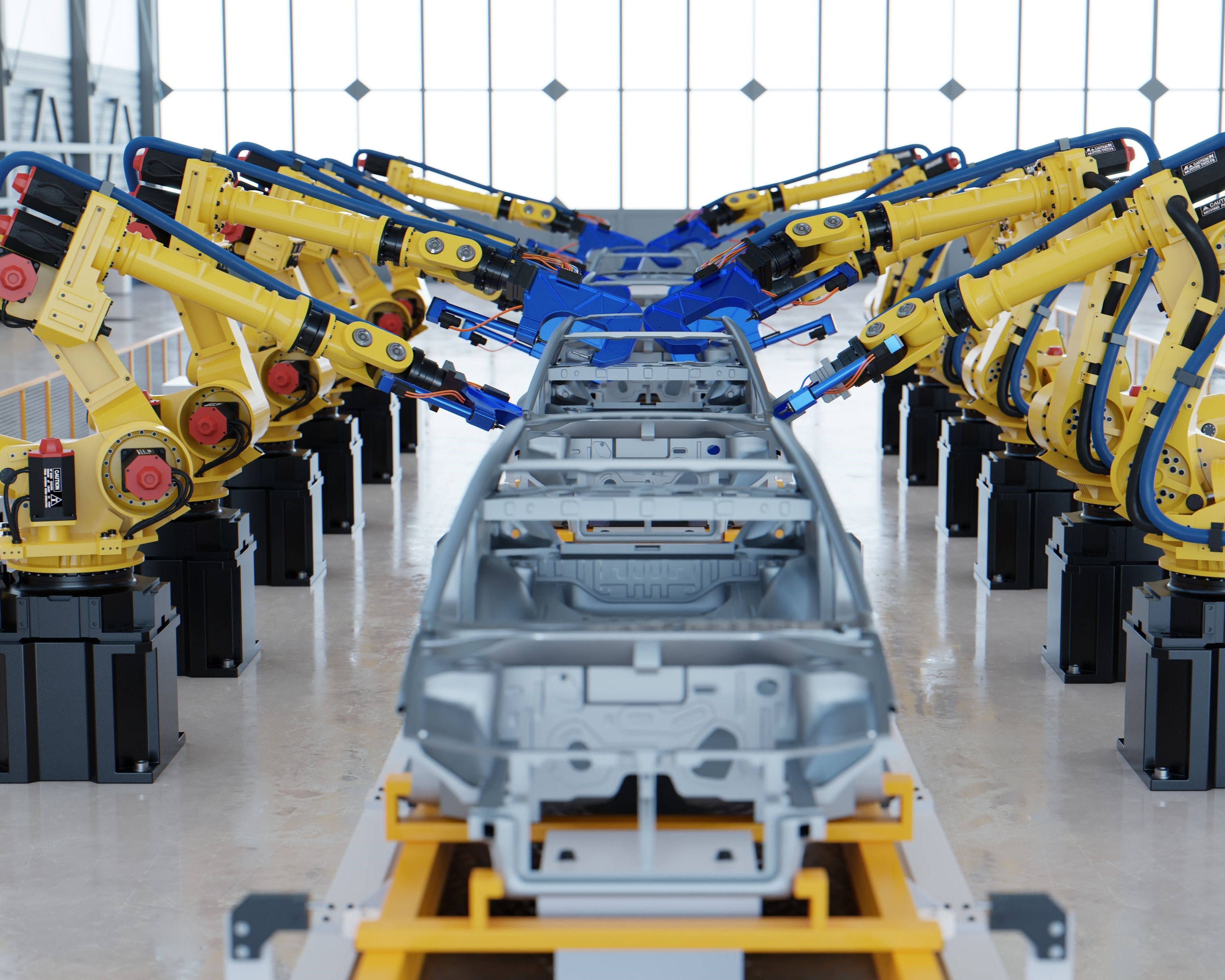 A modern automotive manufacturing assembly line featuring rows of yellow robotic arms working on metallic car chassis. The robotic arms, equipped with blue grippers and precision tools, are symmetrically aligned on either side of the conveyor belt, performing welding or assembly tasks. The car frames are securely positioned on yellow supports as the process takes place. The factory environment has a clean, polished floor and large glass windows that provide ample natural light. This image highlights advanced automation, robotics, and high-efficiency production in the automotive industry.